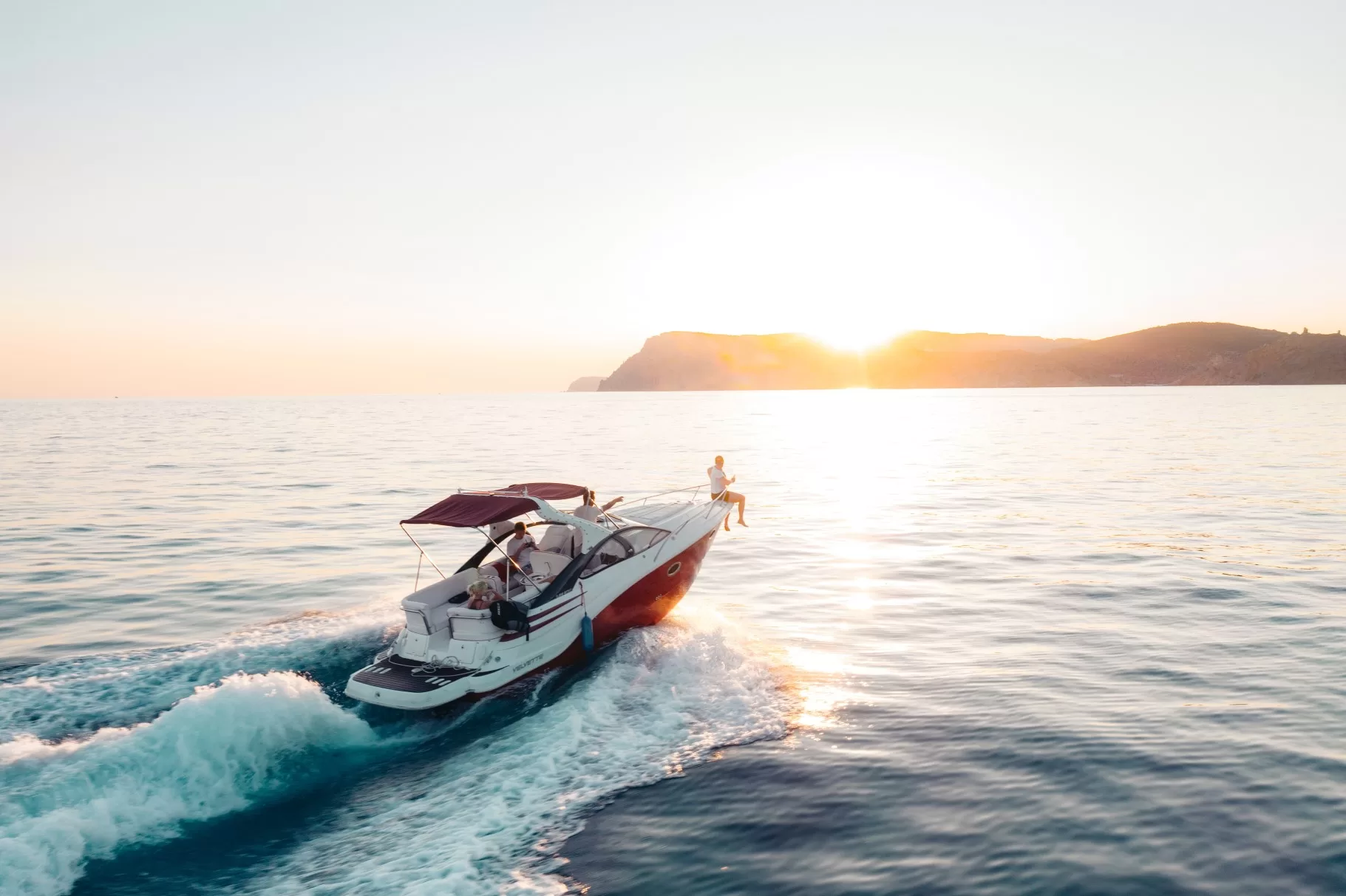 BoatHoist-Blog-Boat-In-Water-Sunset-Ivan-Ragozin-Unsplash